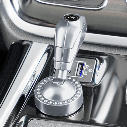 Käynnistyspainikkeen suojakansi automerkki-logolla