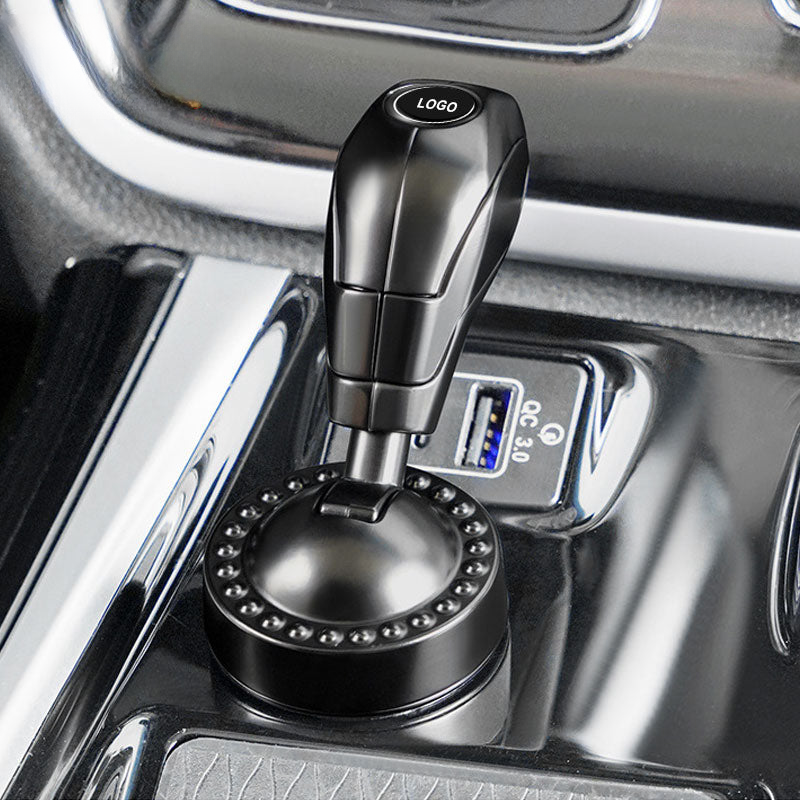 Käynnistyspainikkeen suojakansi automerkki-logolla