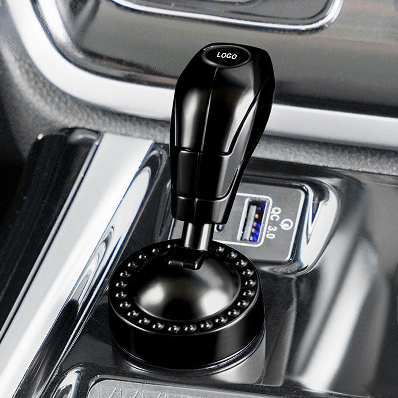 Käynnistyspainikkeen suojakansi automerkki-logolla